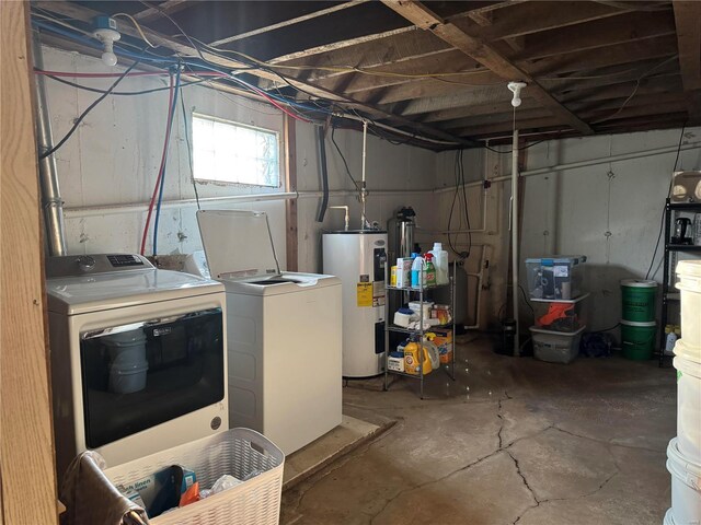 basement with washing machine and clothes dryer and water heater