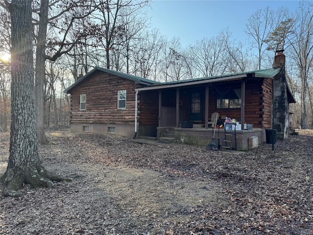 back of property featuring a porch