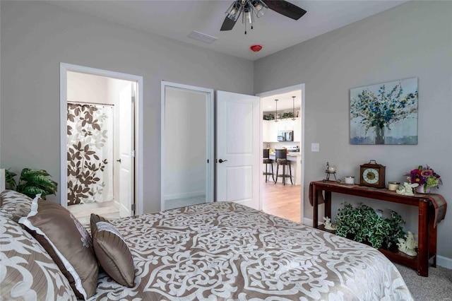 bedroom featuring connected bathroom and ceiling fan