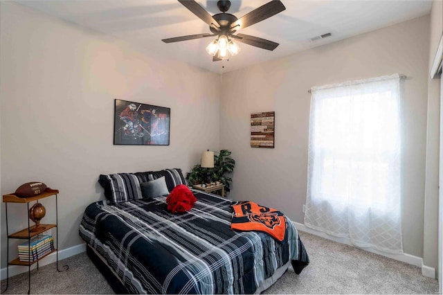 carpeted bedroom featuring ceiling fan