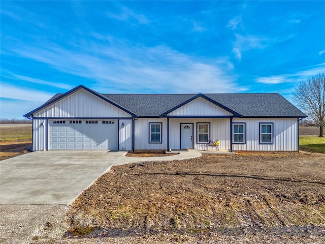 ranch-style house with a garage and a porch