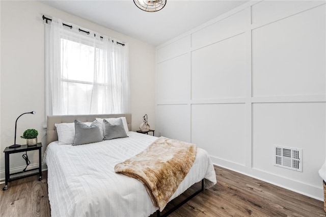 bedroom with hardwood / wood-style floors