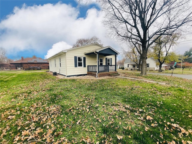 view of front of house featuring a porch and a front yard