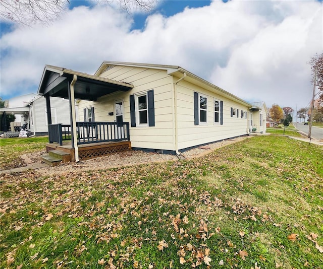 view of property exterior featuring a lawn