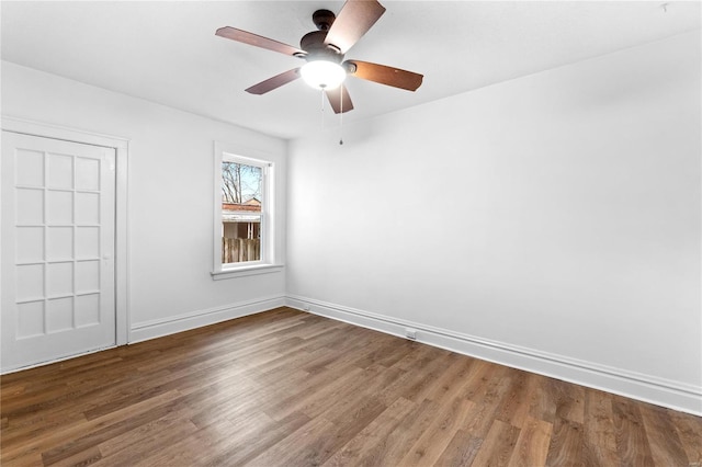 unfurnished room featuring ceiling fan and hardwood / wood-style flooring