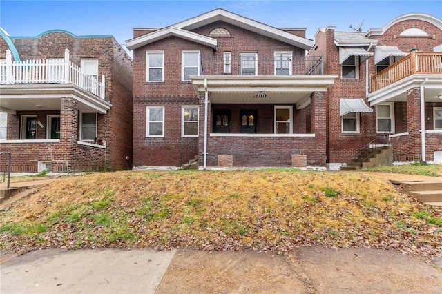 view of front of property with a balcony