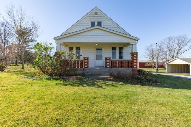 view of front of house with covered porch and a front yard