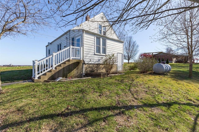 view of property exterior featuring a lawn