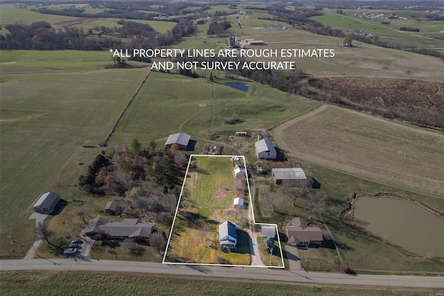 aerial view with a water view and a rural view