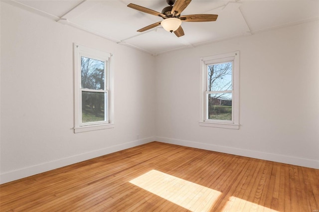 empty room featuring light hardwood / wood-style floors and ceiling fan