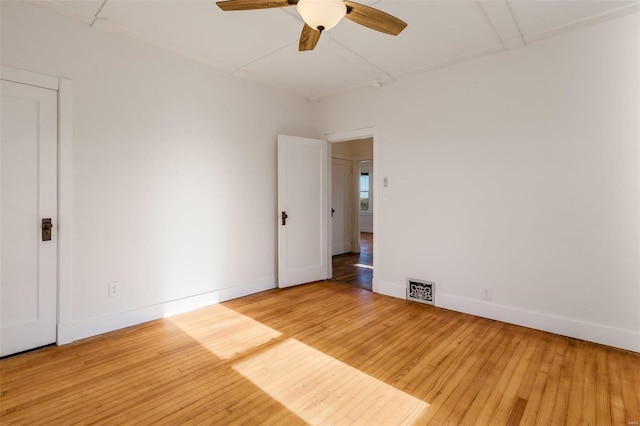 empty room featuring ceiling fan and wood-type flooring