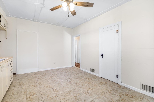 unfurnished room featuring ceiling fan