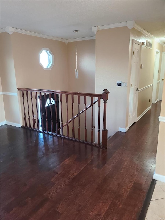 hall featuring dark hardwood / wood-style flooring and ornamental molding