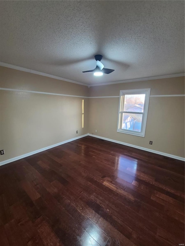 spare room with a textured ceiling, dark hardwood / wood-style flooring, and crown molding