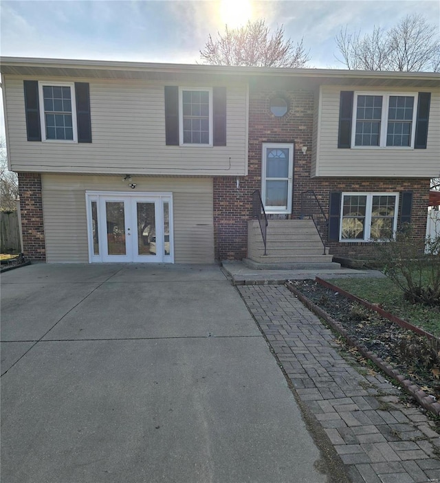 raised ranch featuring french doors