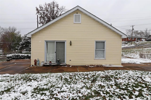 view of snow covered house