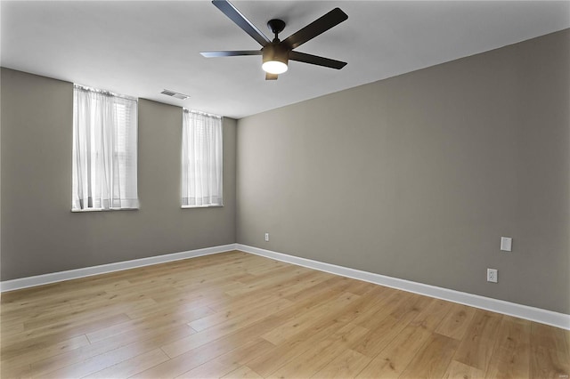 spare room featuring ceiling fan and light hardwood / wood-style floors