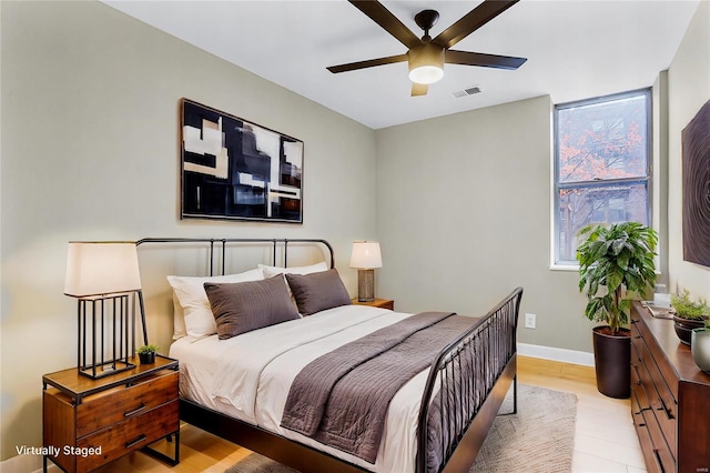 bedroom featuring light wood-type flooring and ceiling fan