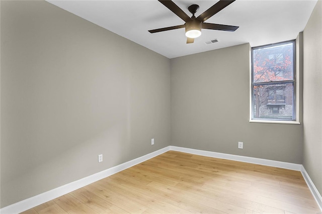 spare room with ceiling fan and light hardwood / wood-style floors