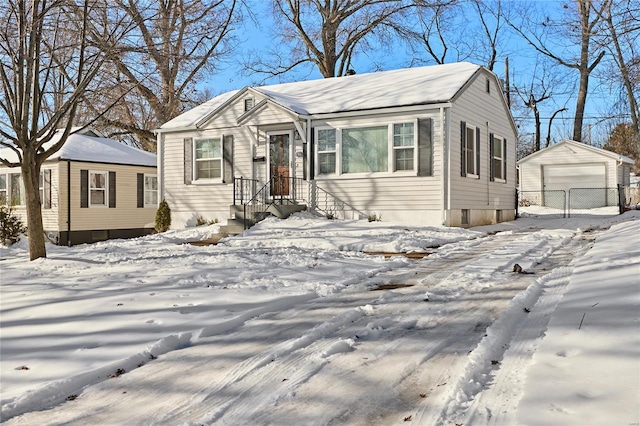 view of front of property featuring an outbuilding and a garage