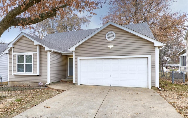 ranch-style house featuring a garage