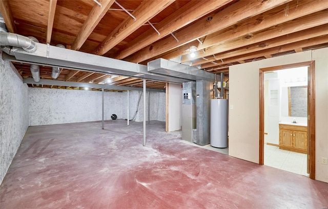 unfinished basement featuring gas water heater