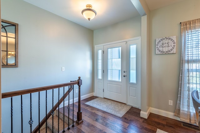 entrance foyer featuring dark wood-type flooring