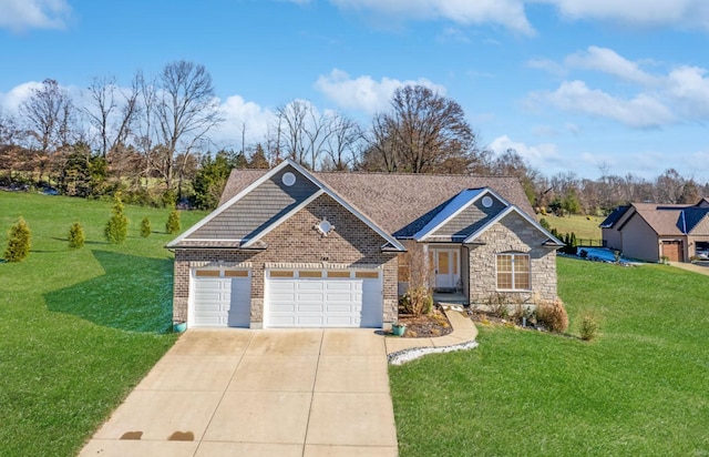 view of front of property featuring a garage and a front lawn