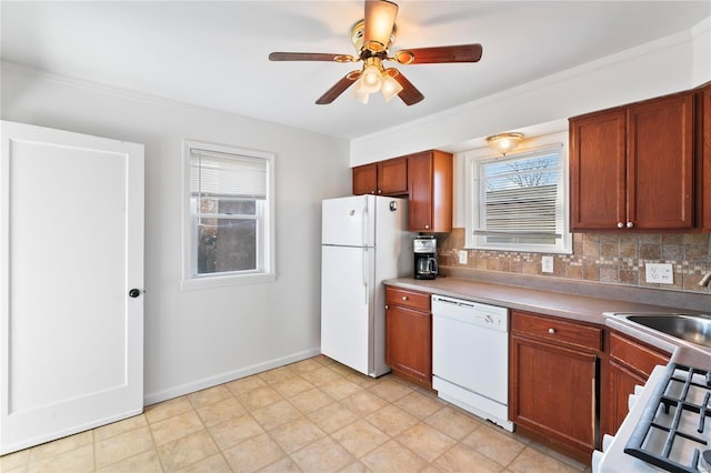 kitchen with white appliances, sink, ceiling fan, ornamental molding, and tasteful backsplash