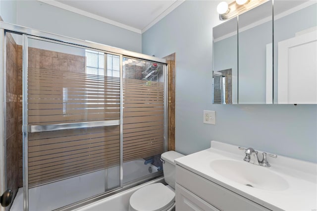 full bathroom featuring shower / bath combination with glass door, vanity, toilet, and crown molding