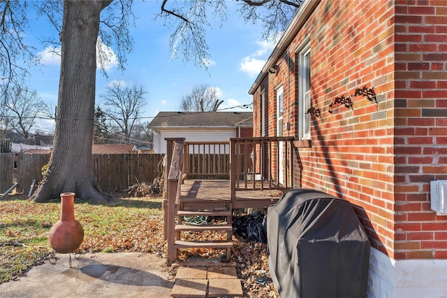 deck featuring a grill