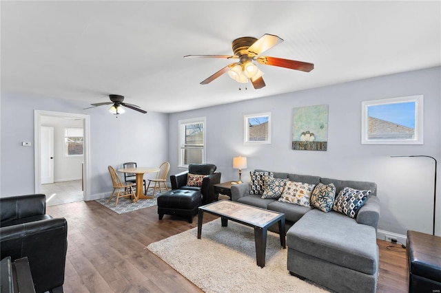 living room with hardwood / wood-style floors and ceiling fan