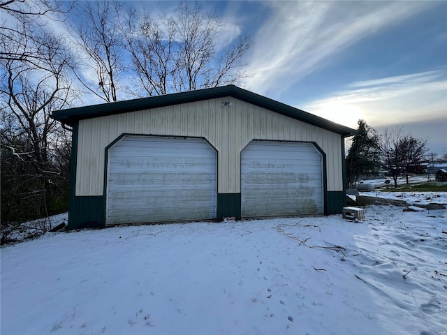 view of snow covered garage