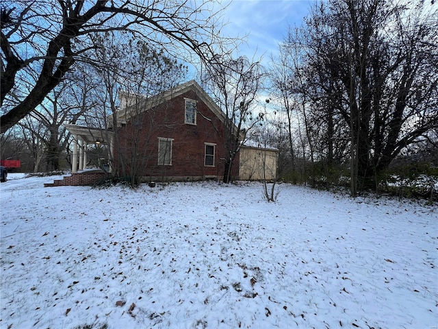 view of snow covered property