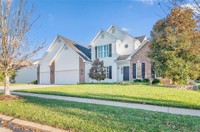 view of property with a garage and a front lawn