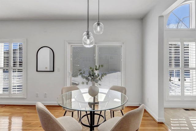 dining space featuring light hardwood / wood-style flooring