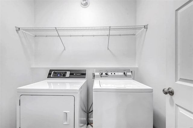 laundry area with washing machine and dryer