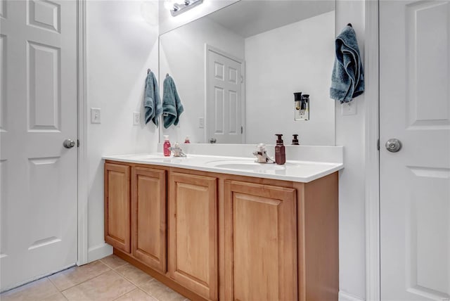 bathroom with tile patterned floors and vanity