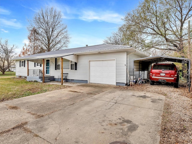 single story home featuring a carport, a porch, and a garage