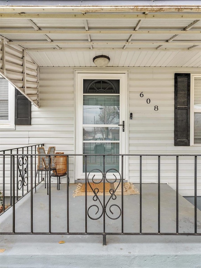 doorway to property featuring covered porch