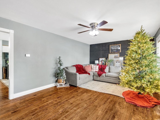 living room featuring ceiling fan and light wood-type flooring