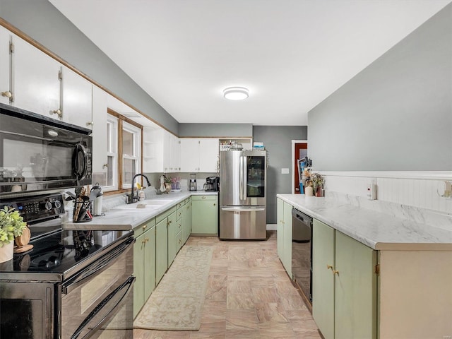 kitchen with green cabinets, white cabinetry, sink, and black appliances