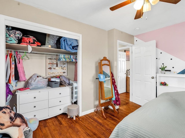 bedroom featuring ceiling fan and dark wood-type flooring