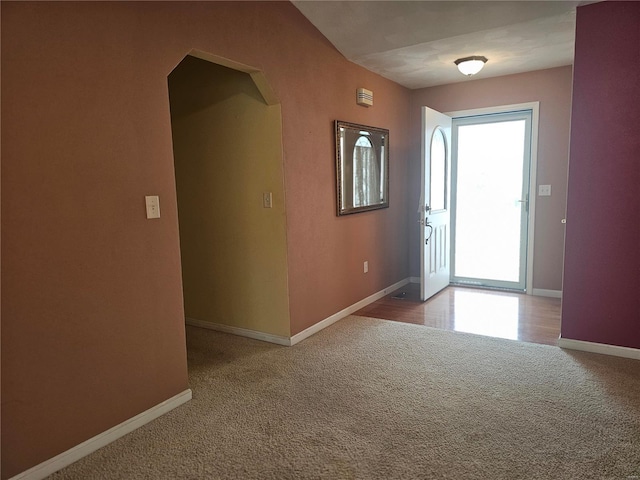 view of carpeted foyer