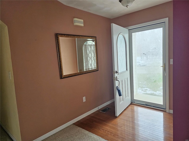 doorway with light hardwood / wood-style floors