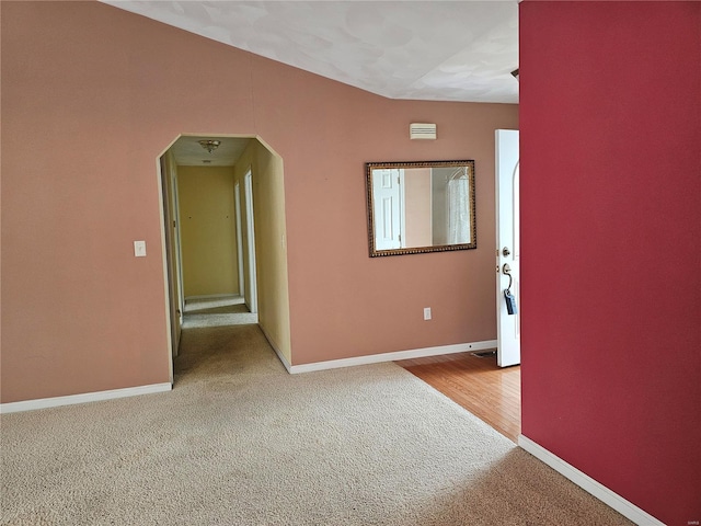 spare room featuring wood-type flooring