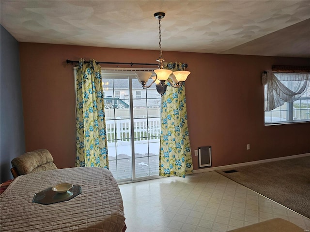 unfurnished dining area with a wealth of natural light, light colored carpet, and a chandelier