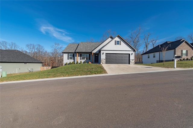 view of front facade featuring a garage and a front lawn