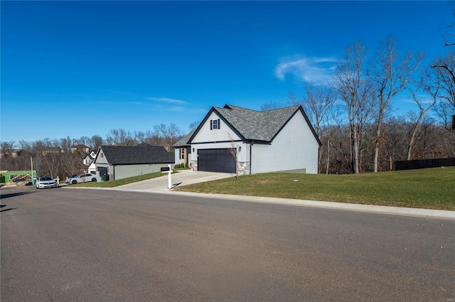 view of front of house featuring a garage and a front yard