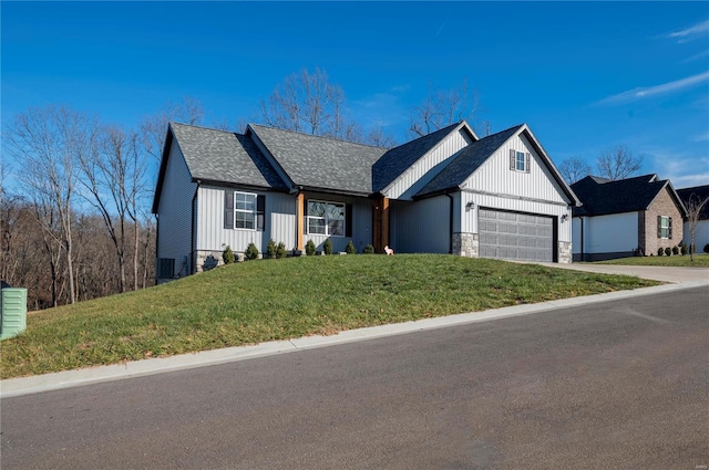 ranch-style house with a garage and a front yard